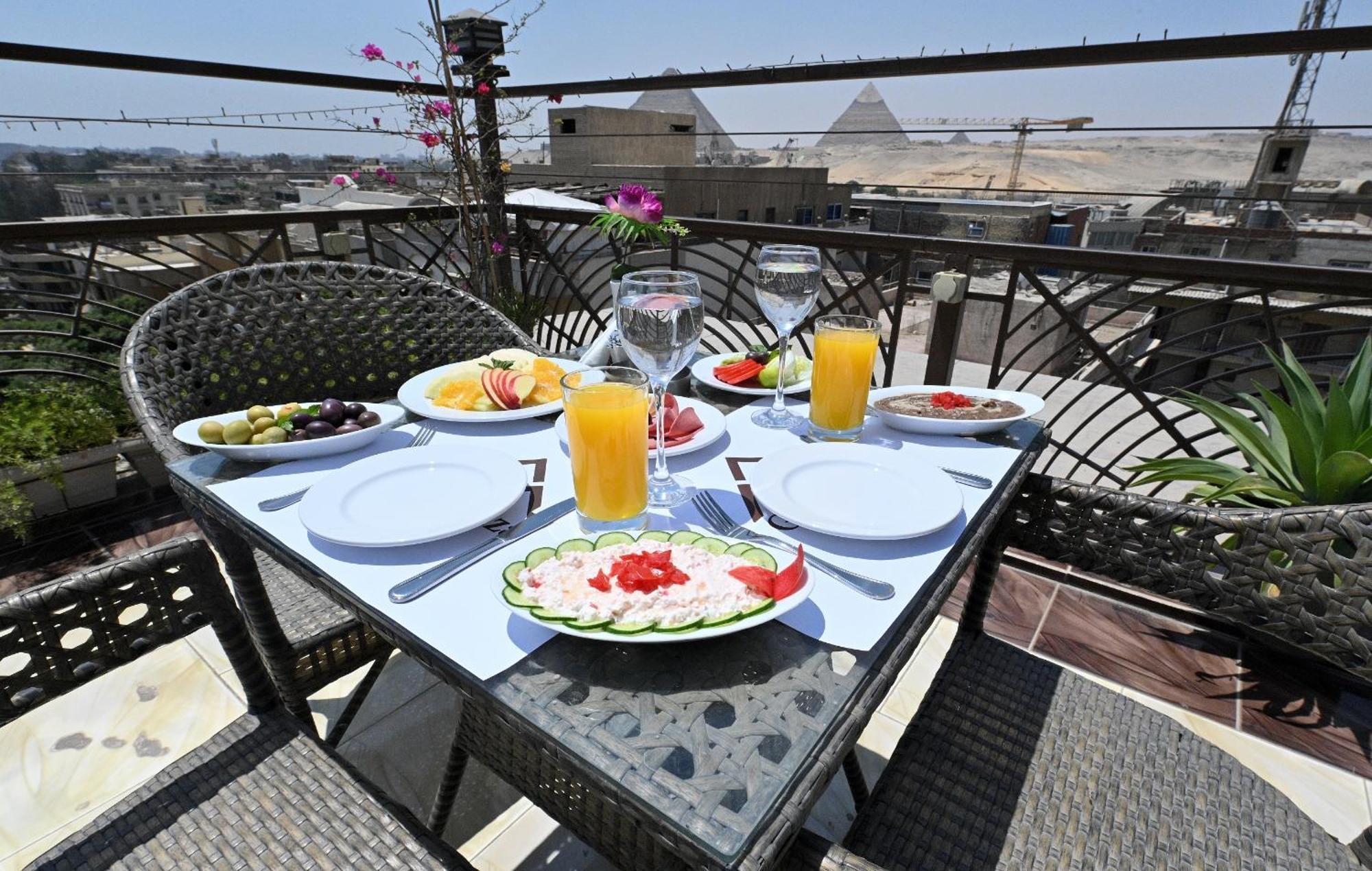 Pyramids Gem Plaza Hotel Kafret el-Gabal Buitenkant foto